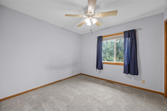 52 Thompson Dr, Palo, IA 52324 - empty room with carpet flooring, a ceiling fan, and a textured ceiling