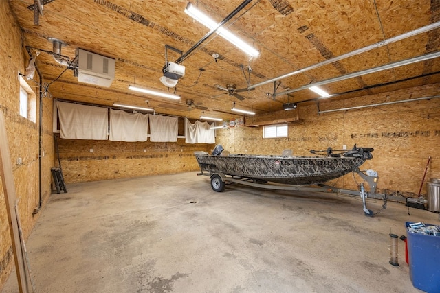 52 Thompson Dr, Palo, IA 52324 - garage with a heating unit, a garage door opener, and a workshop area