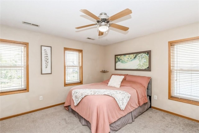 1017 Langenberg Ave, Iowa City, IA 52240 - bedroom featuring light carpet and a ceiling fan