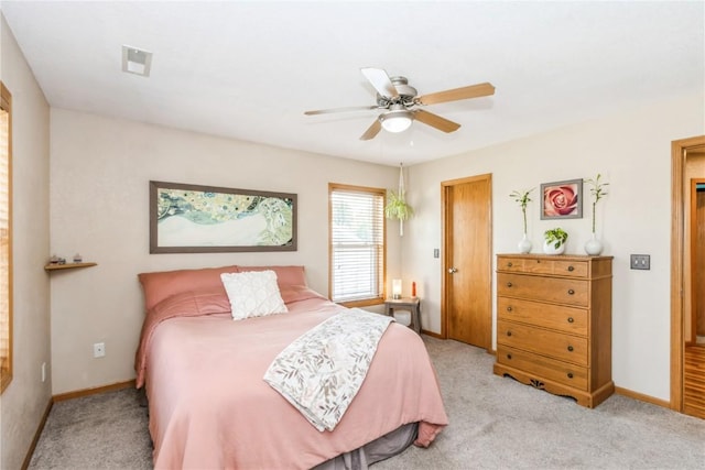 1017 Langenberg Ave, Iowa City, IA 52240 - bedroom featuring light carpet and a ceiling fan