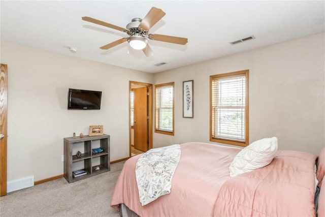 1017 Langenberg Ave, Iowa City, IA 52240 - carpeted bedroom featuring baseboards and ceiling fan