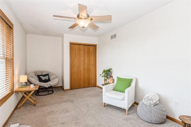 1017 Langenberg Ave, Iowa City, IA 52240 - living area featuring carpet floors and ceiling fan