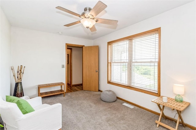 1017 Langenberg Ave, Iowa City, IA 52240 - living area featuring carpet and a ceiling fan