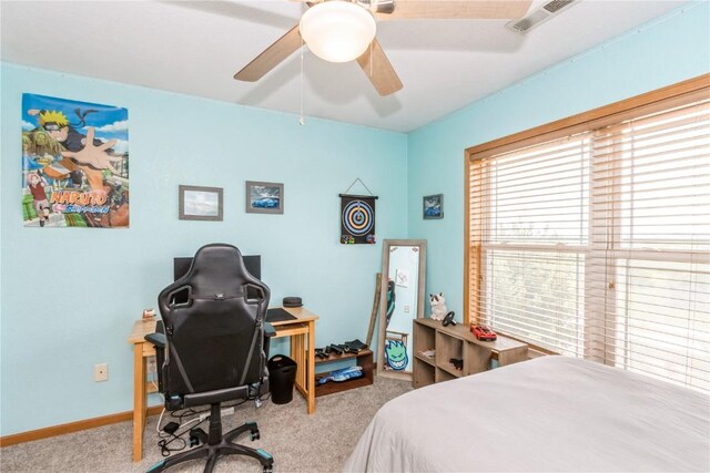 1017 Langenberg Ave, Iowa City, IA 52240 - bedroom with carpet floors, an office area, and ceiling fan