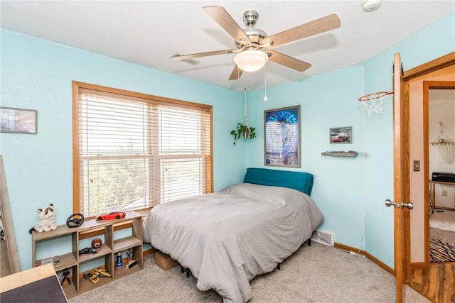 1017 Langenberg Ave, Iowa City, IA 52240 - bedroom with carpet floors and a ceiling fan