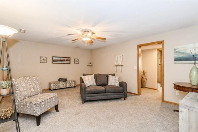 1017 Langenberg Ave, Iowa City, IA 52240 - living room with carpet floors and a ceiling fan