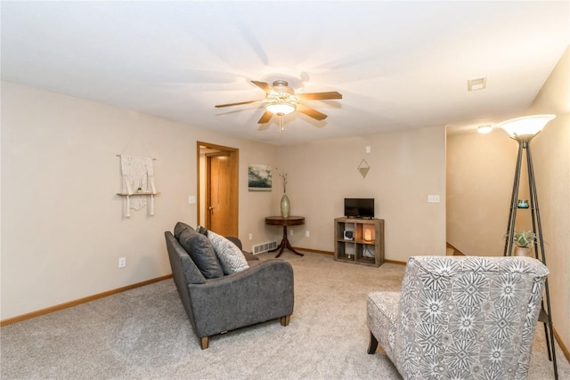 1017 Langenberg Ave, Iowa City, IA 52240 - living room featuring a ceiling fan and light carpet