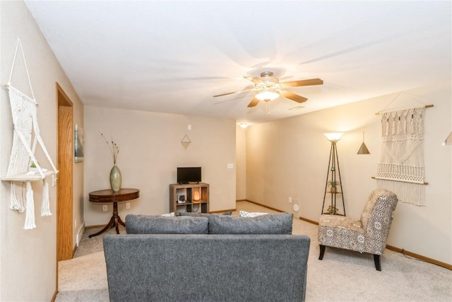 1017 Langenberg Ave, Iowa City, IA 52240 - carpeted living room with a ceiling fan and baseboards