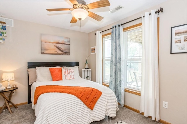 1017 Langenberg Ave, Iowa City, IA 52240 - carpeted bedroom with baseboards and a ceiling fan