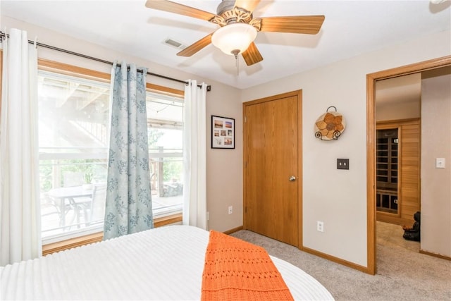 1017 Langenberg Ave, Iowa City, IA 52240 - bedroom with light carpet and ceiling fan
