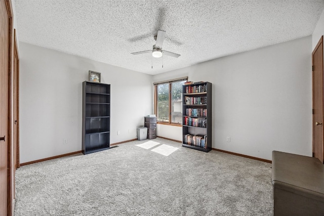 1211 Cambria Ct, Iowa City, IA 52246 - interior space featuring a ceiling fan and a textured ceiling