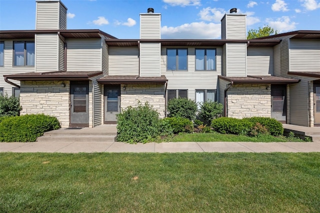 1211 Cambria Ct, Iowa City, IA 52246 - view of front of property with a chimney and stone siding