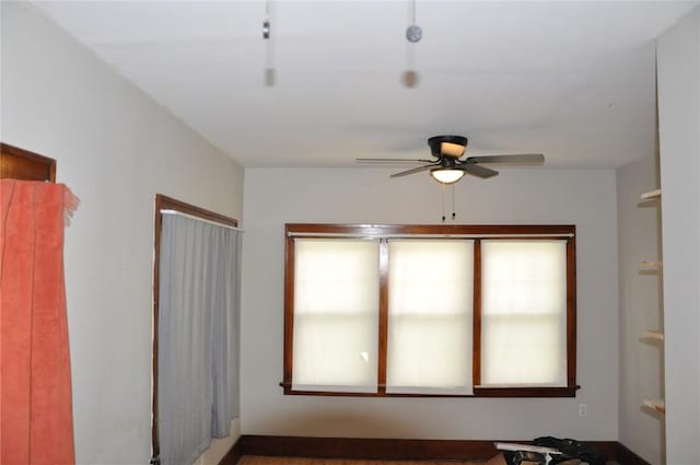 1535 SE 6th Ave, Cedar Rapids, IA 52403 - empty room featuring a ceiling fan and healthy amount of natural light
