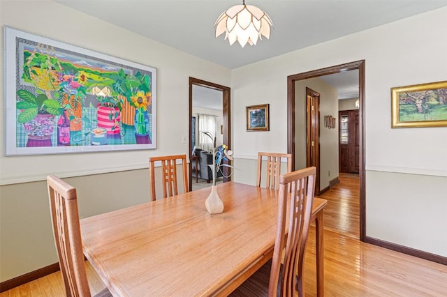 927 Southlawn Dr, Iowa City, IA 52245 - dining space with light wood-style floors and baseboards