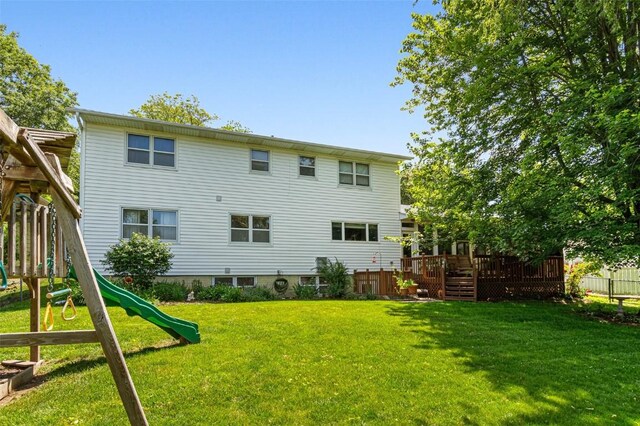927 Southlawn Dr, Iowa City, IA 52245 - back of house with a playground and a wooden deck