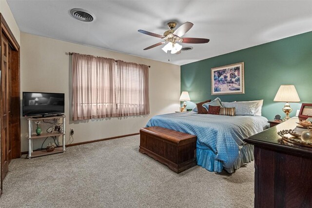 927 Southlawn Dr, Iowa City, IA 52245 - carpeted bedroom with a ceiling fan and baseboards