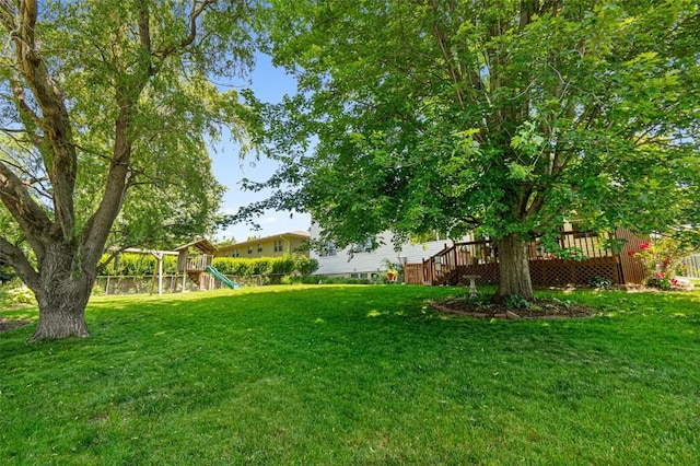 927 Southlawn Dr, Iowa City, IA 52245 - view of yard featuring a playground and a wooden deck