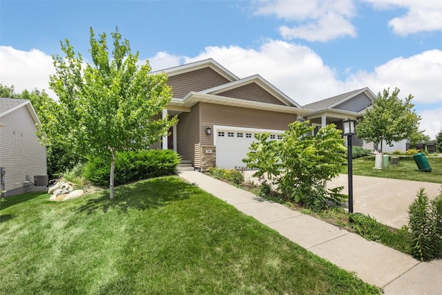 281 Danielle St, Iowa City, IA 52245 - view of front of property with a garage and a front yard