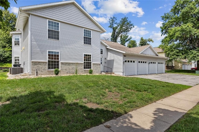 3921 Lexington Dr NE Unit C, Cedar Rapids, IA 52402 - view of front of home featuring an attached garage, driveway, a front yard, and brick siding