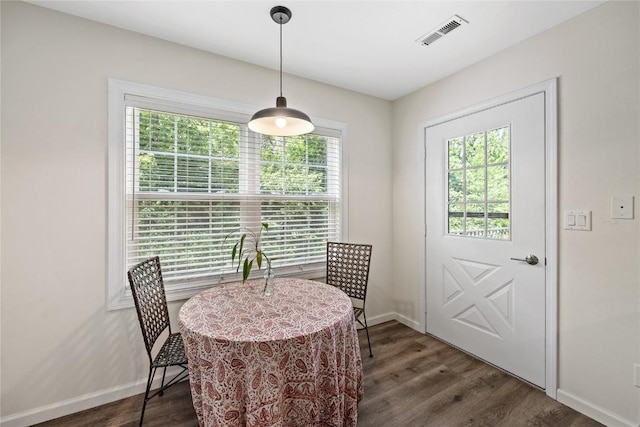 3921 Lexington Dr NE Unit C, Cedar Rapids, IA 52402 - dining area with baseboards and dark wood-style floors