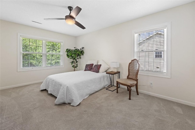 3921 Lexington Dr NE Unit C, Cedar Rapids, IA 52402 - carpeted bedroom featuring baseboards and a ceiling fan