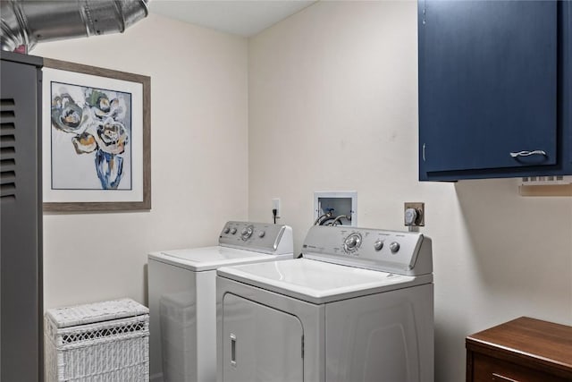 3921 Lexington Dr NE Unit C, Cedar Rapids, IA 52402 - laundry room featuring separate washer and dryer and cabinet space