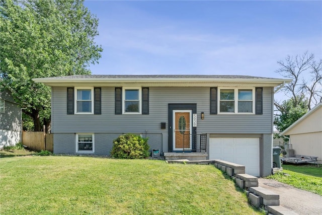 5929 Underwood Ave SW, Cedar Rapids, IA 52404 - bi-level home featuring an attached garage, driveway, and brick siding