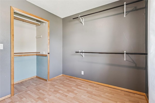 5929 Underwood Ave SW, Cedar Rapids, IA 52404 - spacious closet with wood finished floors