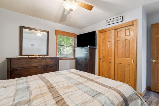 1039 31st St NE, Cedar Rapids, IA 52402 - bedroom with a closet, wood finished floors, and ceiling fan