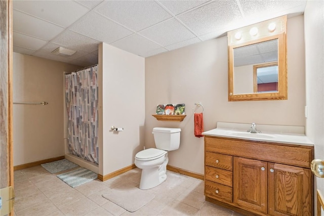 1039 31st St NE, Cedar Rapids, IA 52402 - full bathroom featuring vanity, a paneled ceiling, and a shower with shower curtain