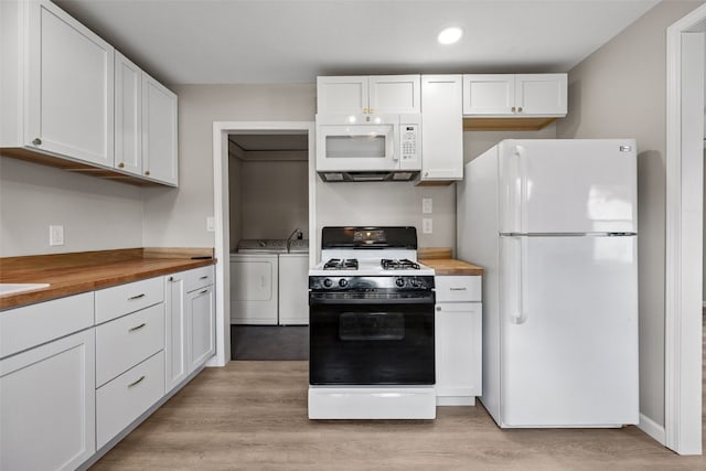 6404 Parkview Ave, Cedar Rapids, IA 52403 - kitchen with white appliances, wood counters, independent washer and dryer, white cabinetry, and recessed lighting