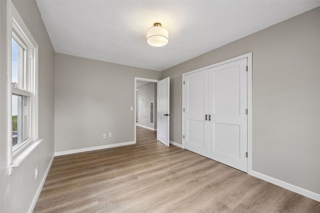6404 Parkview Ave, Cedar Rapids, IA 52403 - unfurnished bedroom with wood finished floors and a closet