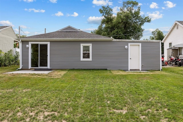 6404 Parkview Ave, Cedar Rapids, IA 52403 - rear view of house featuring a yard, a shingled roof, and a patio area