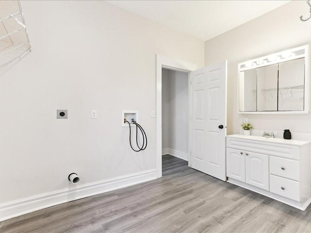 1308 A Ave NW, Cedar Rapids, IA 52405 - laundry room with hookup for a washing machine, electric dryer hookup, and light wood finished floors