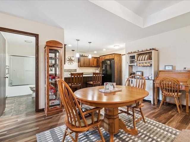 550 Meadow Oak Cir, Fairfax, IA 52228 - dining area featuring dark wood-style flooring