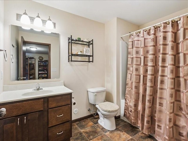 550 Meadow Oak Cir, Fairfax, IA 52228 - full bath with vanity, stone finish floors, and shower / bath combo
