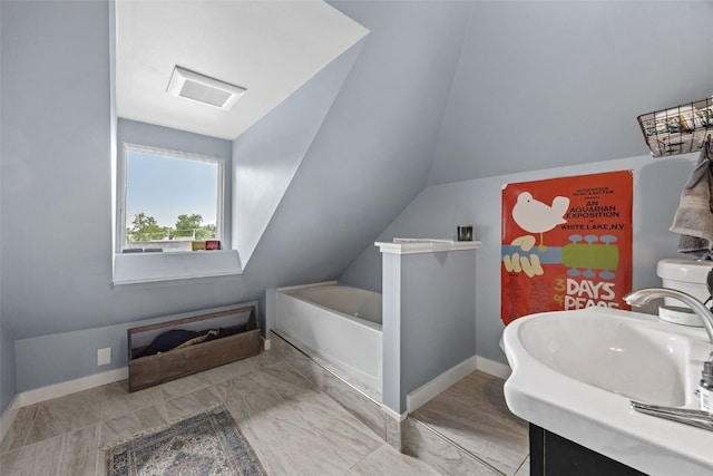 2144 Grande Ave SE, Cedar Rapids, IA 52403 - full bath with a bath, marble look tile flooring, lofted ceiling, and vanity