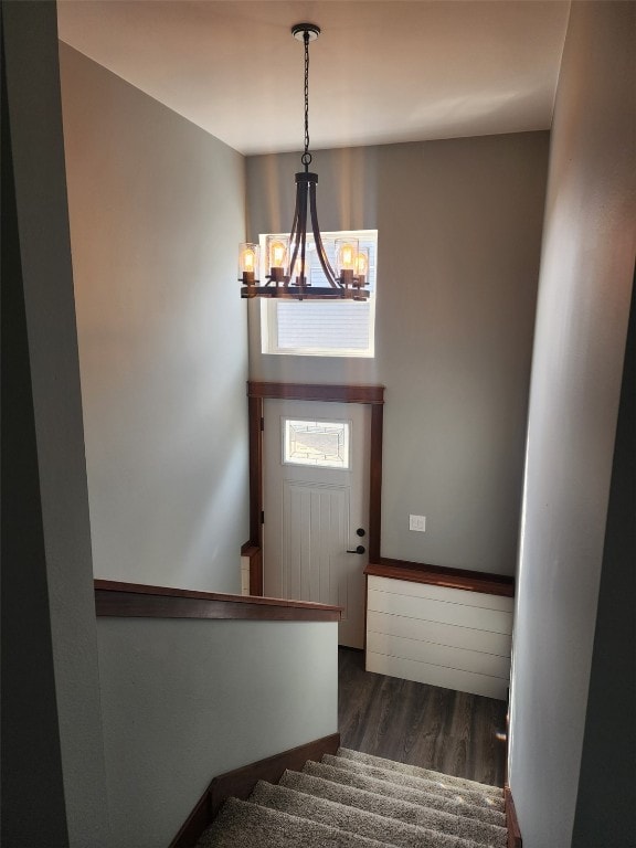 203 William Way, Newhall, IA 52315 - stairs featuring a chandelier and wood finished floors