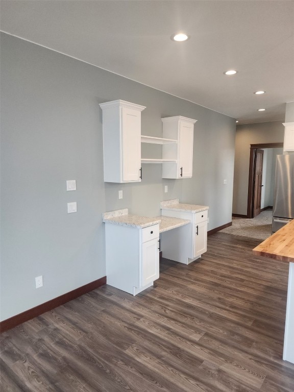 203 William Way, Newhall, IA 52315 - kitchen with freestanding refrigerator, dark wood finished floors, white cabinets, recessed lighting, and open shelves