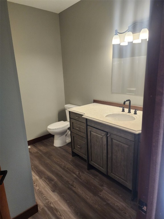 203 William Way, Newhall, IA 52315 - bathroom with wood finished floors and vanity