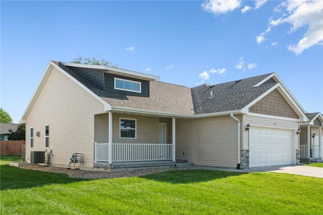 914 Deer Run Dr NE, Cedar Rapids, IA 52402 - view of front of property featuring a porch, a garage, roof with shingles, and concrete driveway