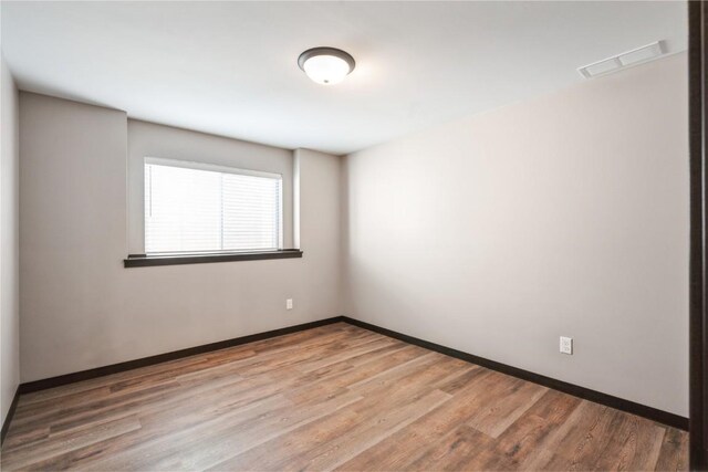 914 Deer Run Dr NE, Cedar Rapids, IA 52402 - empty room featuring wood finished floors and baseboards
