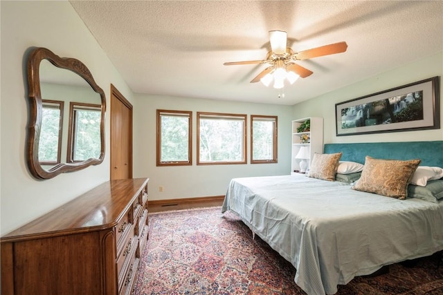 1579 Matterhorn Dr NE, Cedar Rapids, IA 52402 - bedroom featuring a textured ceiling and ceiling fan