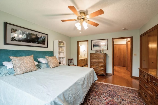 1579 Matterhorn Dr NE, Cedar Rapids, IA 52402 - bedroom featuring wood finished floors, connected bathroom, and a ceiling fan