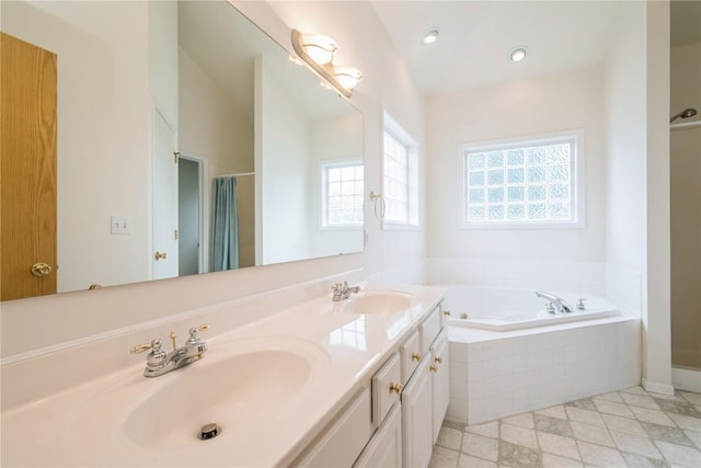 2500 Creekside Dr, Hiawatha, IA 52233 - full bath featuring a garden tub, double vanity, a shower with shower curtain, recessed lighting, and tile patterned flooring