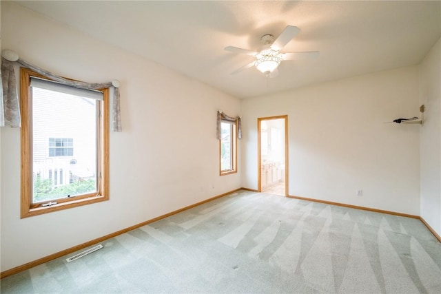 2500 Creekside Dr, Hiawatha, IA 52233 - unfurnished room with light colored carpet and a ceiling fan