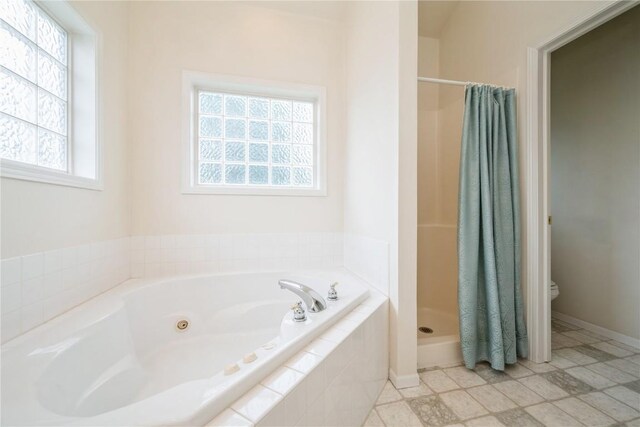 2500 Creekside Dr, Hiawatha, IA 52233 - full bathroom featuring a whirlpool tub and a shower stall
