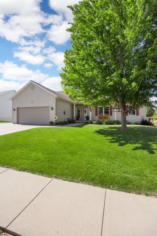 2515 Woodhill Dr SW, Cedar Rapids, IA 52404 - view of front of property featuring a garage, a front yard, and concrete driveway