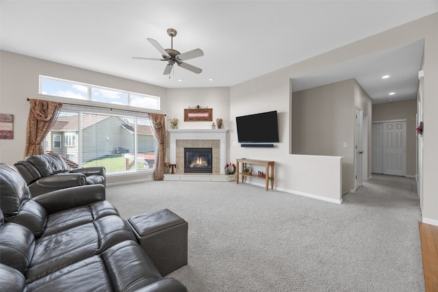 2515 Woodhill Dr SW, Cedar Rapids, IA 52404 - living room with ceiling fan, a tiled fireplace, recessed lighting, and carpet