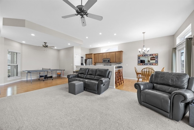 2515 Woodhill Dr SW, Cedar Rapids, IA 52404 - living area featuring healthy amount of natural light, light colored carpet, a chandelier, ceiling fan, and recessed lighting